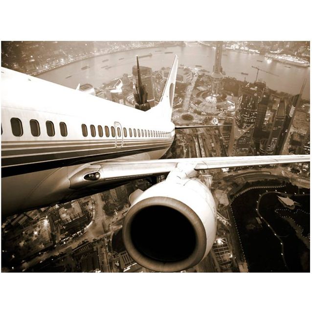Kuvatapetti Artgeist Lentokone yli kaupungin eri kokoja
