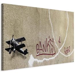 Taulu Artgeist Banksy's Plane (1-part) - Red Graffiti Text on Mural Background, eri vaihtoehtoja